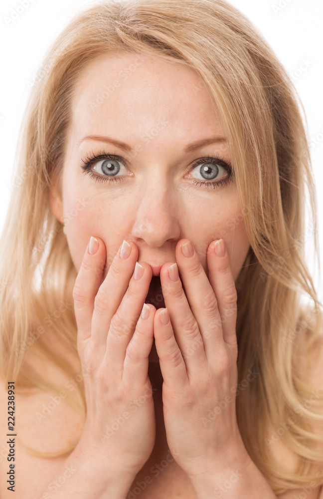 Beautiful woman surprised, covered her face with hands, close-up Beautiful woman surprised, covered her face with hands, close-up