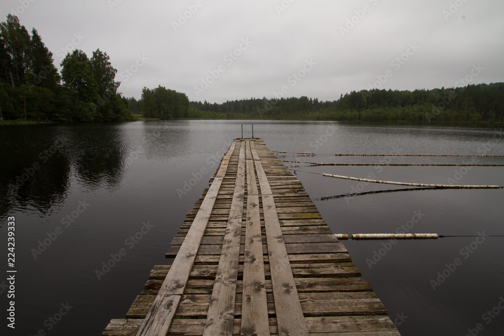 Fototapeta premium A boat pier on a still lake.