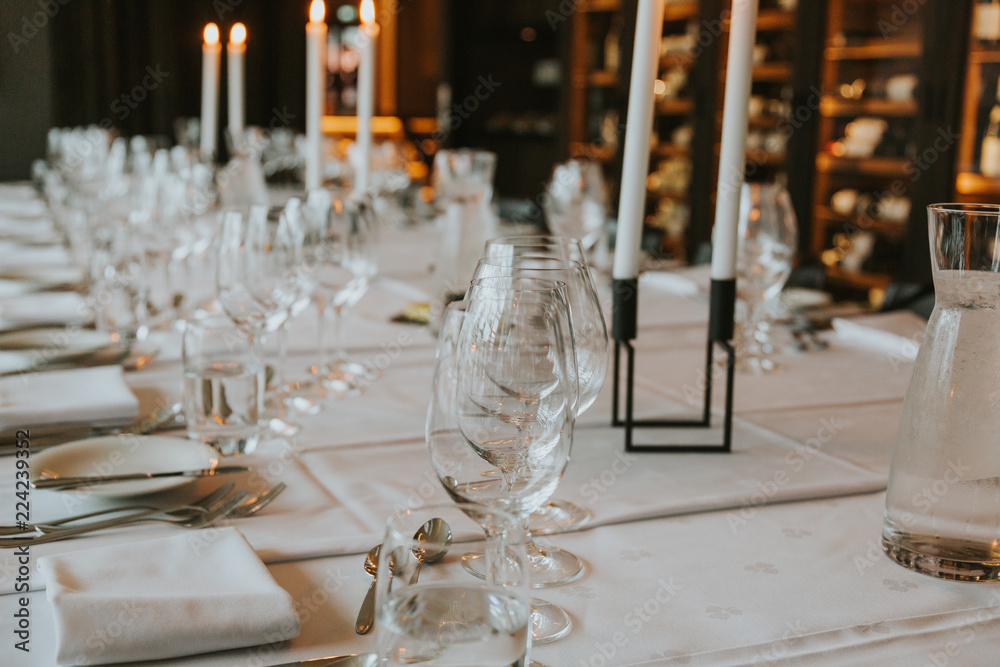 A selection of wine glasses on a table. A selection of wine glasses on a table.
