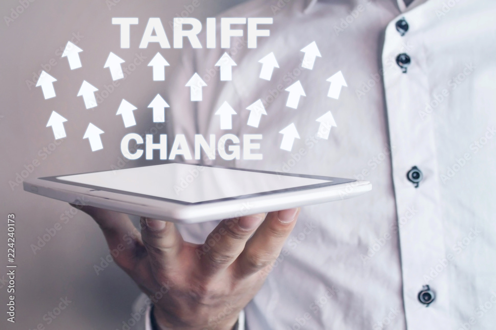 Man holding arrows with Tariff Change words. Business concept Man holding arrows with Tariff Change words. Business concept