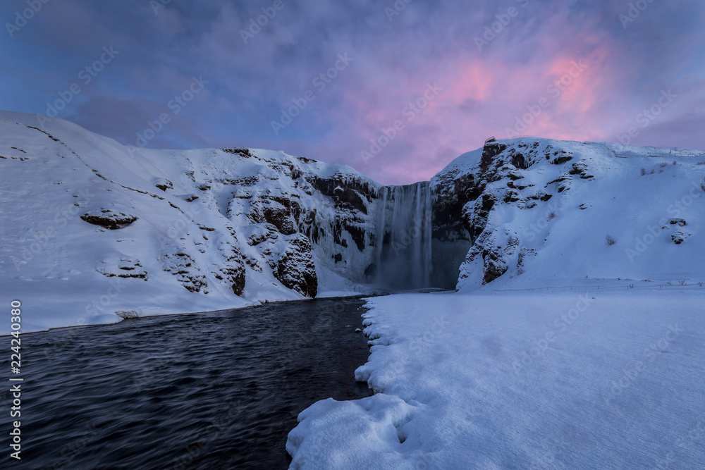 Skogafoss waterfall alone in a cold winter day
