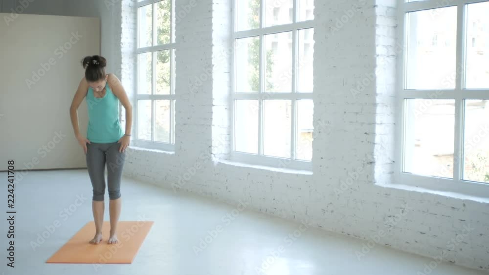 4K, Female Doing Stretching Workout On Exercise Mat At White Fitness Class 4K, Female Doing Stretching Workout On Exercise Mat At White Fitness Class