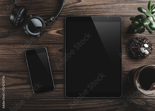 Wallpaper Mural Mock-up blank screen tablet and phone, office desk table for a coffee break. Top view Torontodigital.ca