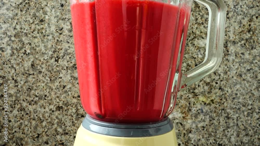 Preparation in the blender of a cocktail from raspberry, bananas and apples. Process of preparation of cocktail. Preparation in the blender of a cocktail from raspberry, bananas and apples. Process of preparation of cocktail.