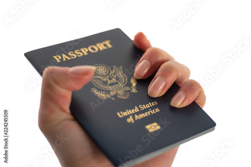 Isolated photo. Holding Passport of USA on white shiny background.