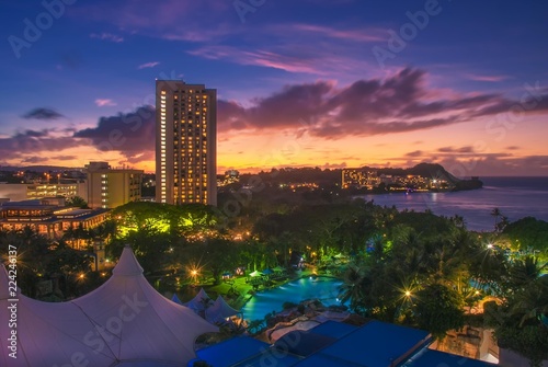 A dramatic sunset over Tumon Bay in Guam. Guam is one of the Mariana Islands in the Pacific Ocean.