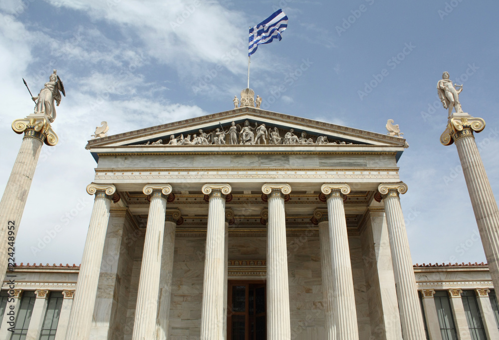 Academy of Arts in Athens with ionic columns and statues of Athena (goddess of defensive war and patron of Athens) and Apollo (god of the Sun).