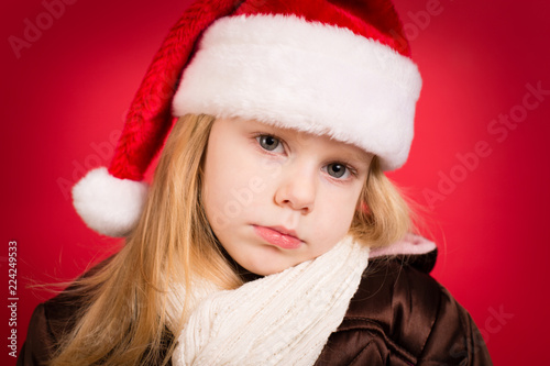 Pensive Little Christmas Girl in Winter Clothing