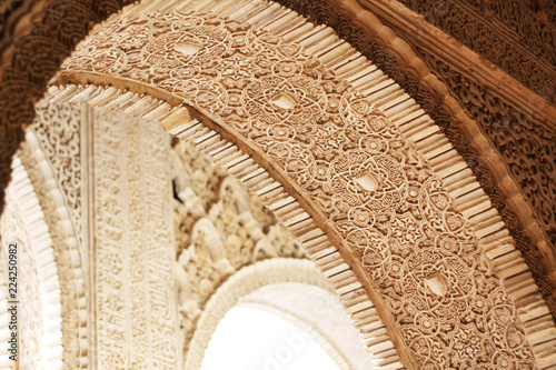 Closeup of arch in the Palacios Nazaries of the Alhambra of Granada, Spain.