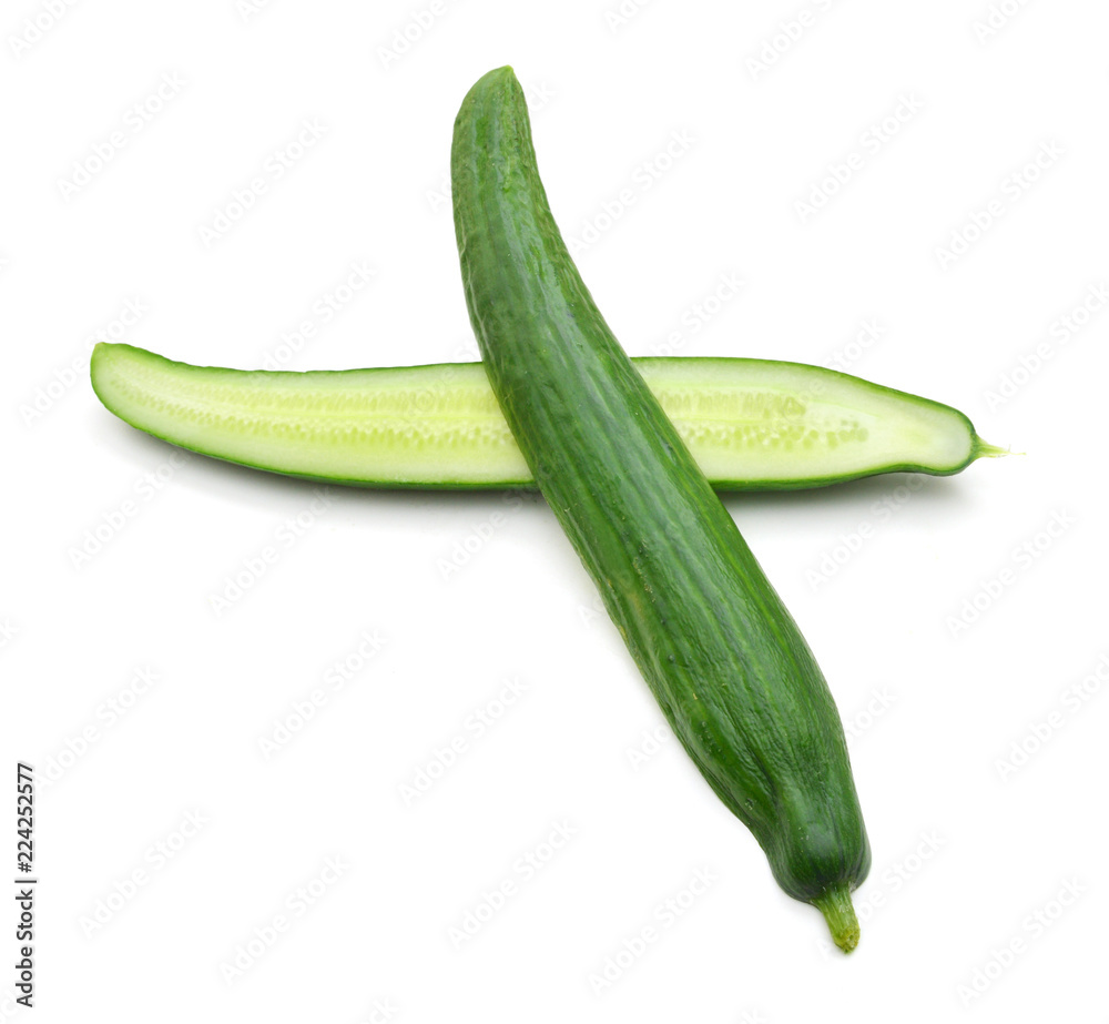 Two cut halves of standing green cucumber isolated on white Two cut halves of standing green cucumber isolated on white