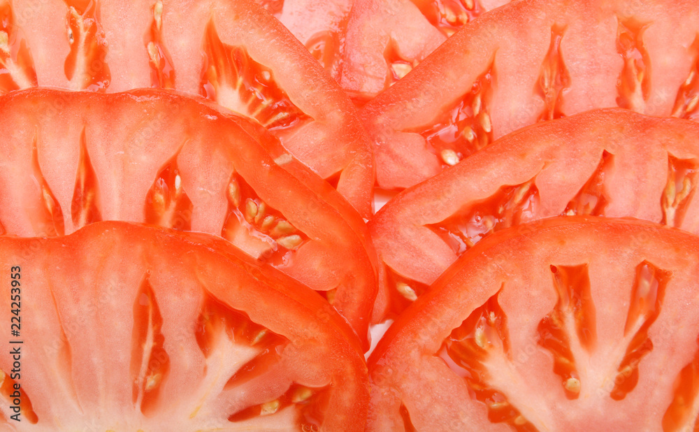 Group of sliced tomatoes forming a background Group of sliced tomatoes forming a background