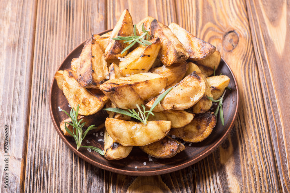 Homemade grilled potatoes with rosemary Homemade grilled potatoes with rosemary