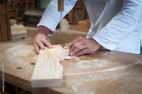 Artisan of wood working in his workshop.
