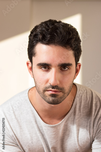 young adult man confident standing in front of camera