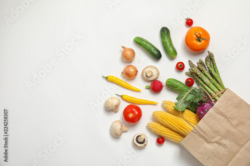 Flat lay composition with fresh vegetables and space for text on white background