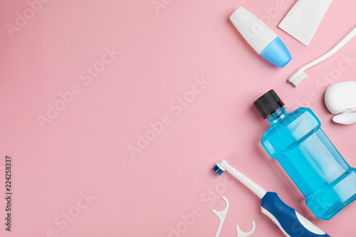 Fototapeta Naklejka Na Ścianę i Meble -  Flat lay composition with oral care products and space for text on color background. Teeth hygiene