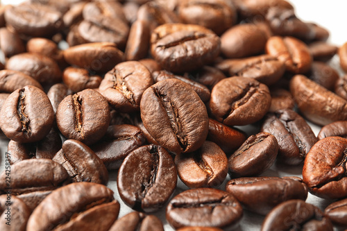 Pile of roasted coffee beans as background  closeup