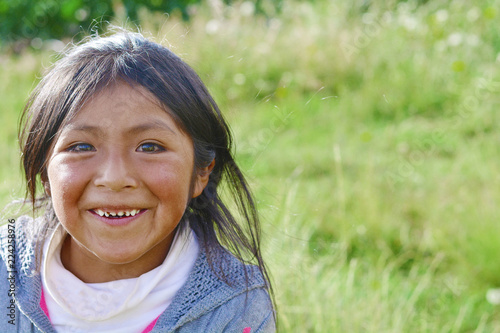 Happy little native american girl in the countryside.