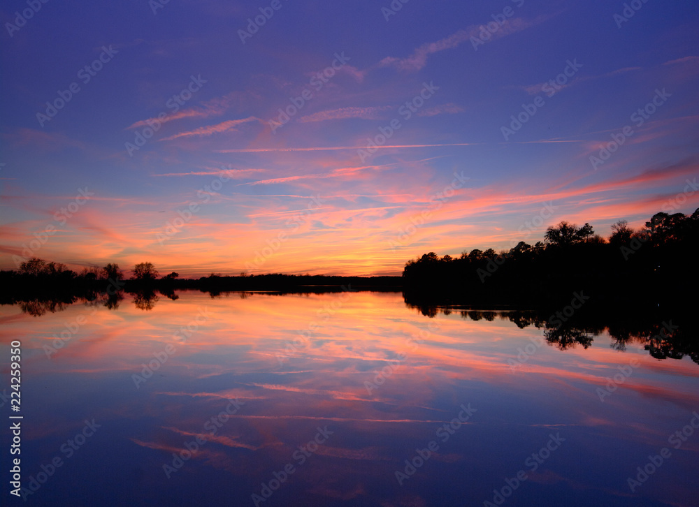 mirrored sunset over lake