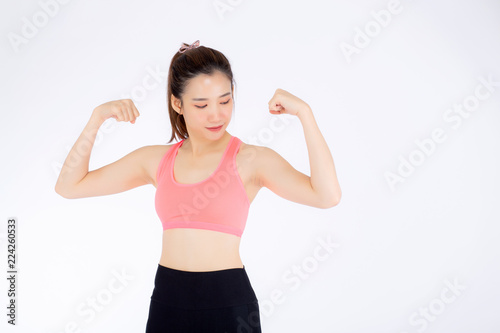 Beautiful portrait asian woman wear sport clothes have strong and muscle with health, girl show biceps with exercise and workout for wellness isolated on white background, strength and fit concept.