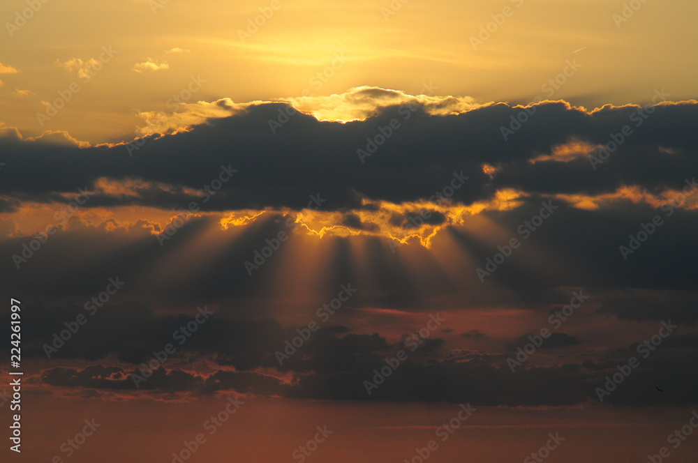 Sunset clouds with sun rays
