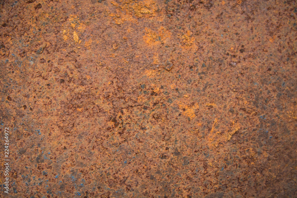 Brown rust stains texture of the old white paint on rusty metal wall. Rusty metal background. Brown rust stains texture of the old white paint on rusty metal wall. Rusty metal background.