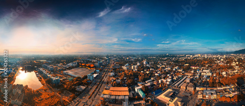 CHIANG MAI, THAILAND- AUGUST 7, 2018 : Aerial Panorama View of Chiang Mai City with sunrise and clouds, with infrared filter effect. © somchairakin