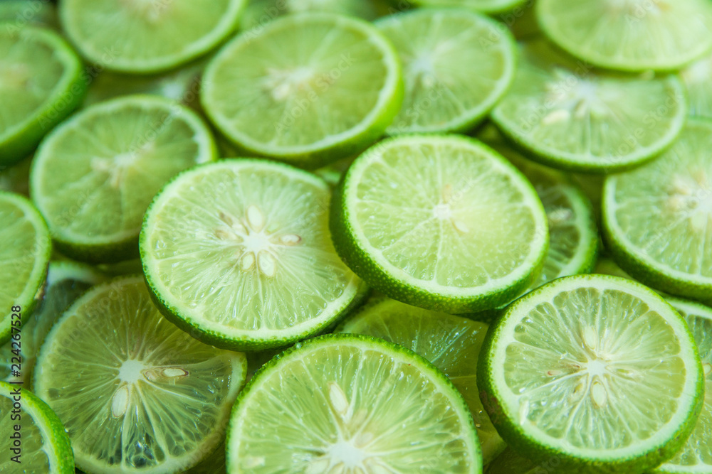 Citrus fruit of lime slices background