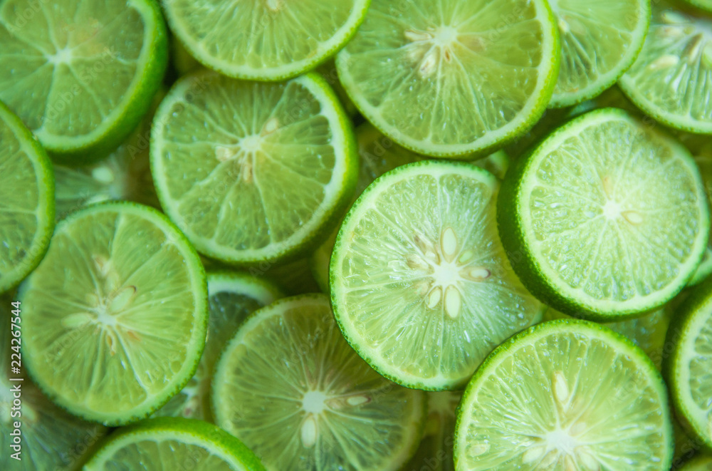 Citrus fruit of lime slices background Citrus fruit of lime slices background