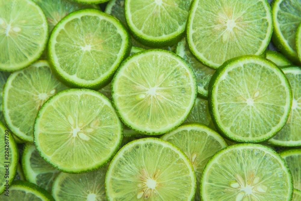 Citrus fruit of lime slices background