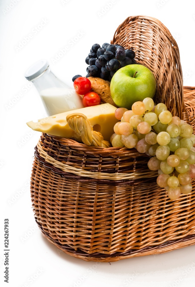 Cheeses, Apple, Grape, Bread, Tomatoes and Milk in the Picnic Cheeses, Apple, Grape, Bread, Tomatoes and Milk in the Picnic