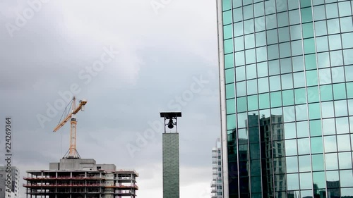 Timelapse of a building site and an active church clock. photo