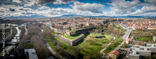 Aerial panorama view of fortified medieval Pamplona in Spain with dramatic cloudy blue sky photo