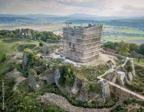 Aerial view of ruined medieval Saros castle with a donjon, walls, towers  in Slovakia