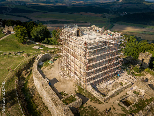 Aerial view of ruined medieval Saros castle with a donjon, walls, towers  in Slovakia photo