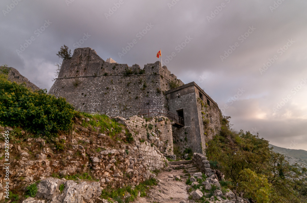 Kotor fort bastion above the medieval Venetian city in Montenegro with cloudy background