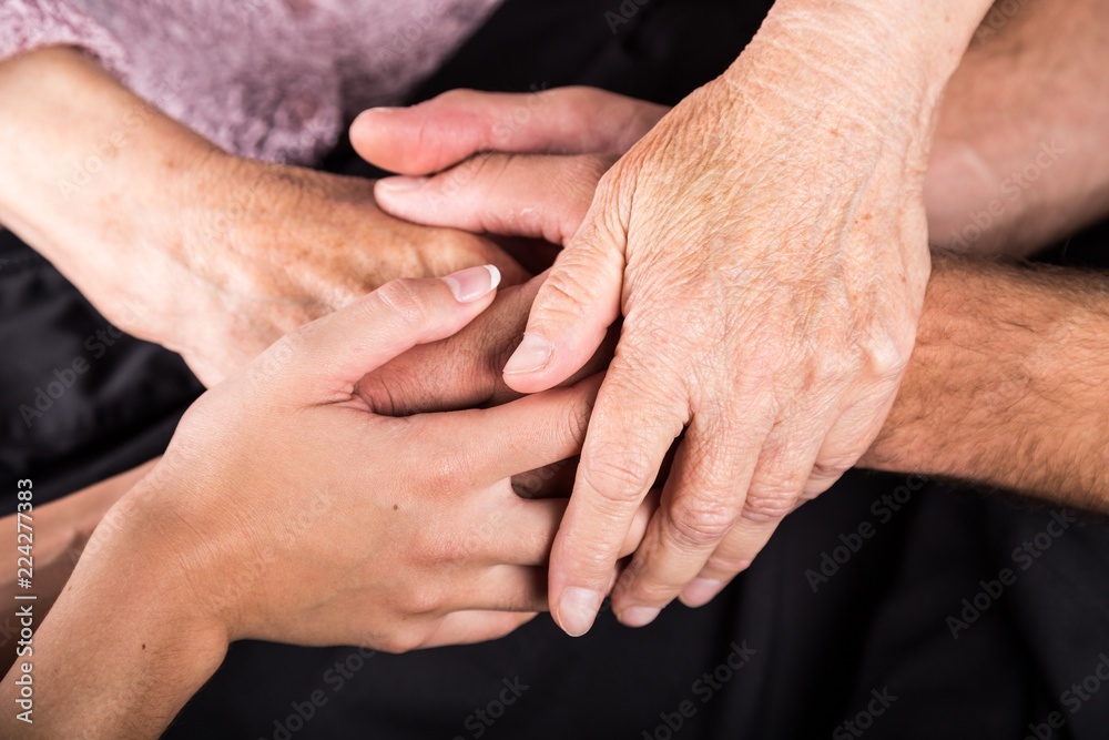 Man and Woman Hands Holding an Old Woman's Hands Man and Woman Hands Holding an Old Woman's Hands