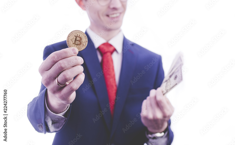 Businessman in suit holding bitcoin and money on white background Businessman in suit holding bitcoin and money on white background
