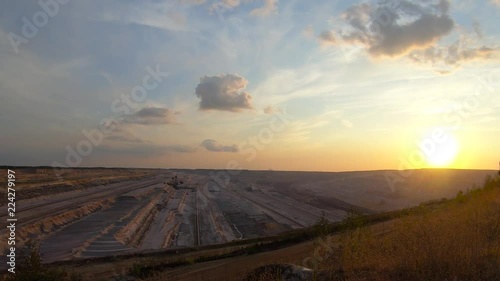 Timelapse of sunset at an open pit mine photo