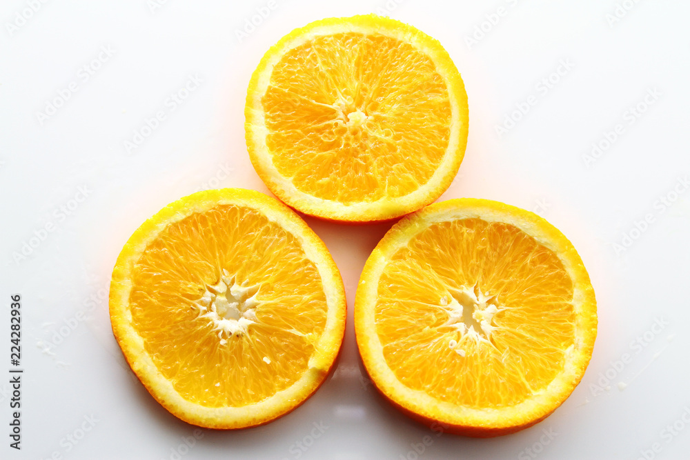 Orange Slice on white background / Orange is a citrus fruit that is quite delicious, juicy with high content Vitamin C. 