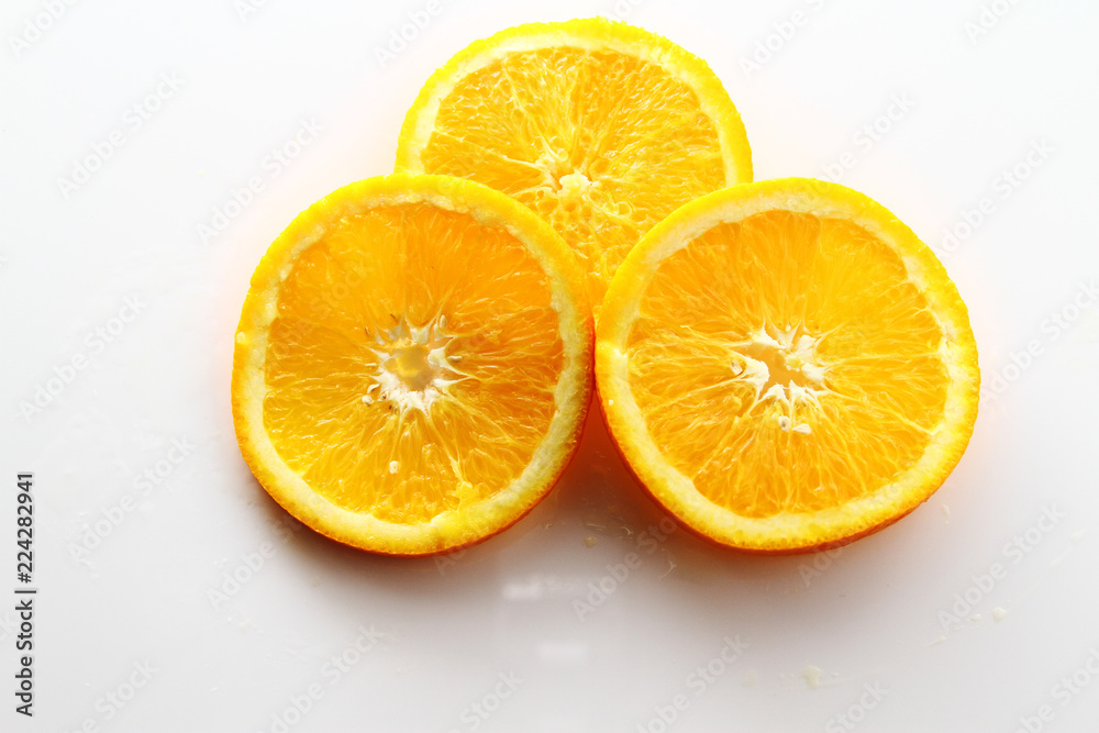 Orange Slice on white background / Orange is a citrus fruit that is quite delicious, juicy with high content Vitamin C. Orange Slice on white background / Orange is a citrus fruit that is quite delicious, juicy with high content Vitamin C.