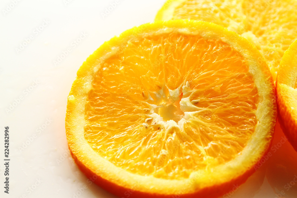 Orange Slice on white background / Orange is a citrus fruit that is quite delicious, juicy with high content Vitamin C. Orange Slice on white background / Orange is a citrus fruit that is quite delicious, juicy with high content Vitamin C.