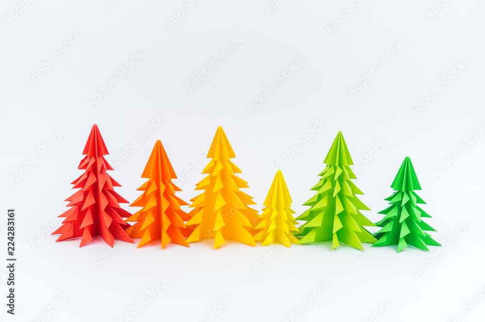 Obraz premium Multicolored paper Christmas tree white background