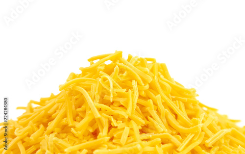 Pile of Grated Cheddar Cheese on a White Background