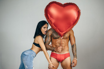 I Love You. Couple In Love. Mens Sexy Lingerie. Fetish Clothing and accessories. Party Celebration Success Concept. Intimate relationship and sexual relations. Valentines day. Red heart