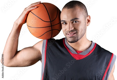 Young handsome sporty man with basketball ball isolated on white