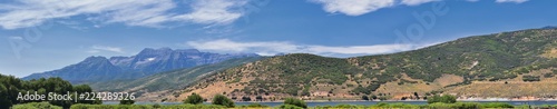 Panoramic Landscape view from Heber, Utah County, view of backside of Mount Timpanogos near Deer Creek Reservoir in the Wasatch Front Rocky Mountains, and Cloudscape. Utah, USA. photo
