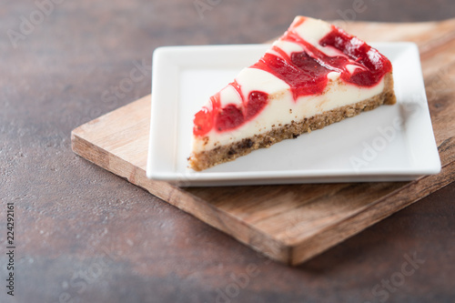 strawberry raspberry swirl cheesecake slice  photo