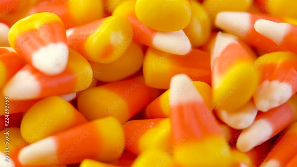 Macro closeup of Halloween traditional Candy Corn treats background. Macro closeup of Halloween traditional Candy Corn treats background.