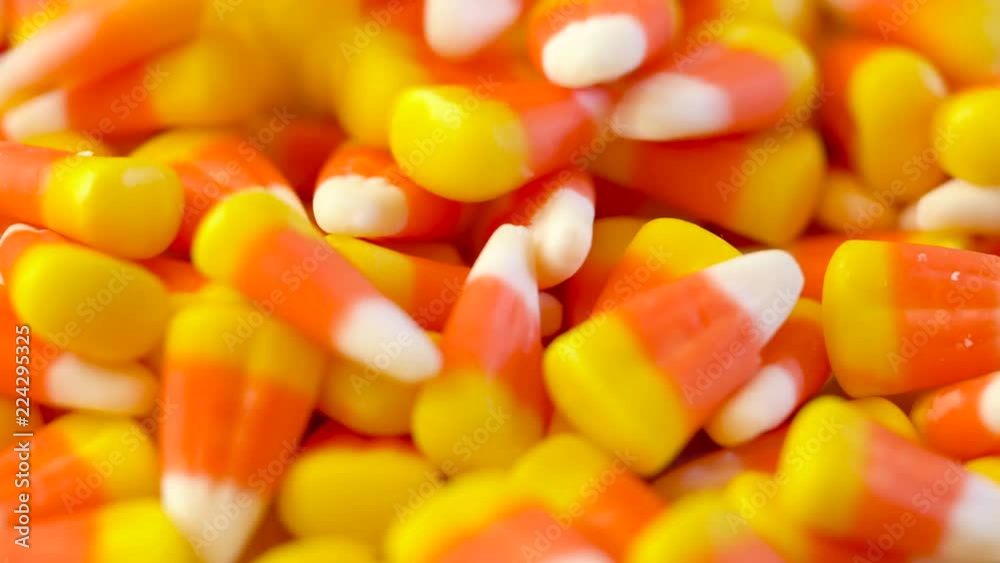 Macro closeup of Halloween traditional Candy Corn treats background.